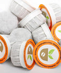 A stack of loose coffee pods.