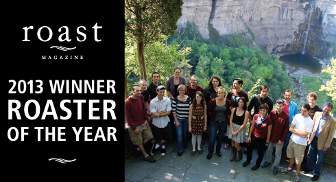 Assembled Gimme! staff at Taughannock Falls Overlook with text: "Roast Magazine 2013 Macro Roaster of the Year"